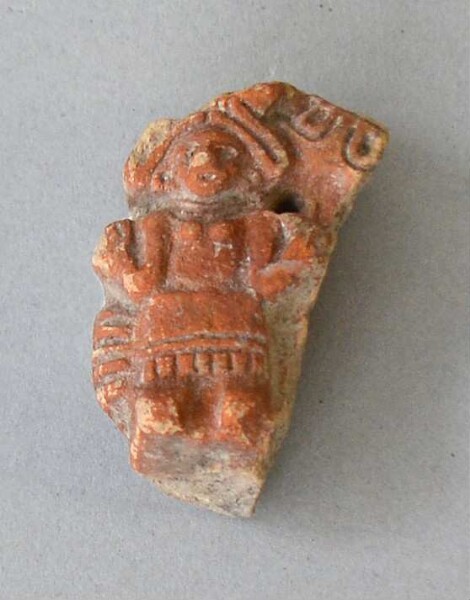 Figurine en argile (fragment de récipient)