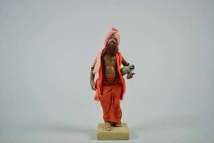 Tonfigur eines Sadhu mit Schlafmatte