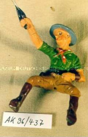 Reitender Cowboy mit Pistole im Anschlag