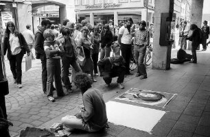 Freiburg i. Br.: Straßenmaler an der Ecke Rathausgasse
