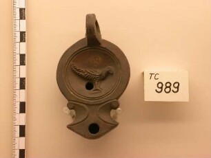 Römische Bildlampe - Diskus: Vogel nach rechts, gelochter Scheibenhenkel