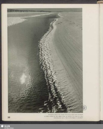 Flimmernde Sonne über einem Priel an der Kante einer Sandbank