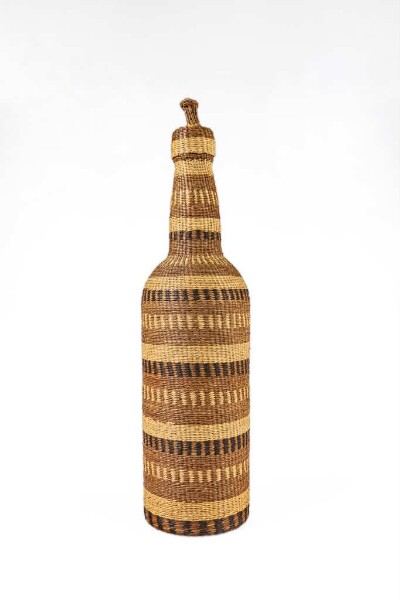 Bottle with raffia cover