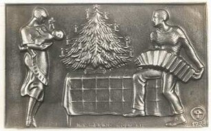 Jahresplakette, dargestellt: Weihnachtsidyll der deutschen Familie : Vater, Mutter und Kind unterm Baum