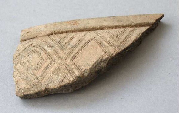 Fragment of a clay vessel