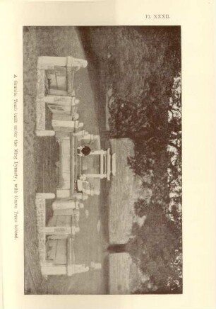 A granite tomb built under the Ming Dynasty, with grave trees behind
