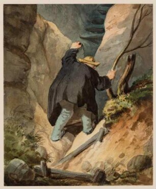 Kletternder Mann in einer Felsschlucht