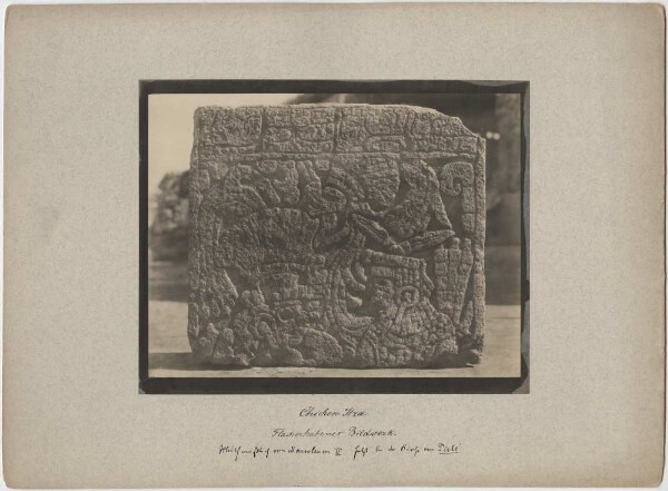 "The upper part of a flat raised sculpture, presumably from Mausoleum II; currently at the church of Pisté. Discovery by Teobert Maler."