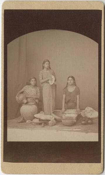 Three Zapotec women at work in the kitchen.