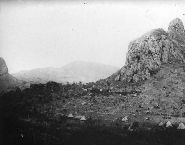 Mountain landscape in the grasslands. Native huts.