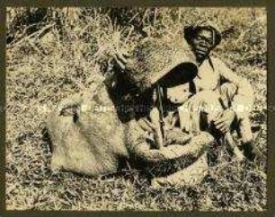 Afrikaner mit dem Kopf eines Nilpferdes