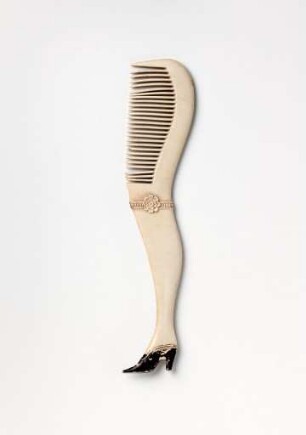 Schnurrbartkamm in Form eines weiblichen Beines