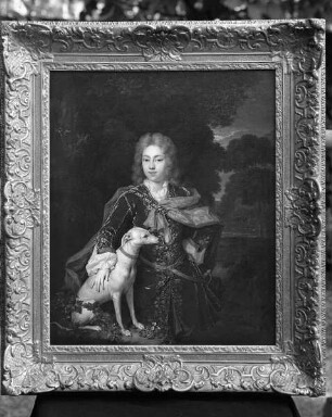 Kniestück eines vornehmen jungen Mannes mit Hund