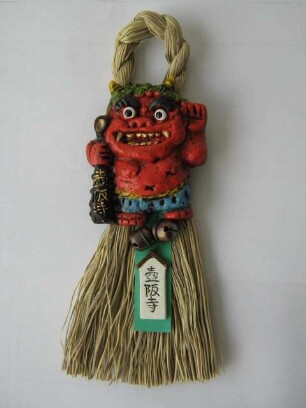 Flachfigur eines Oni 魔除面