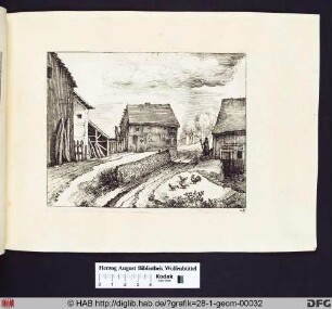 Eine Straße zwischen zwei Schuppen.