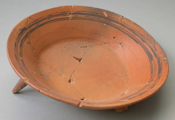 Three-footed clay bowl