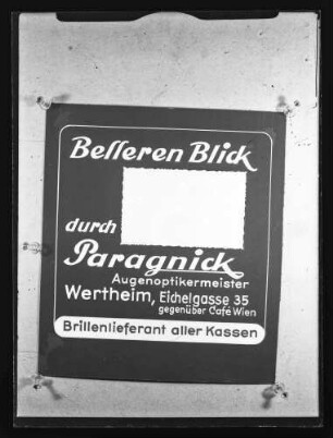 Werbung des Augenoptikermeisters Paragnick, Eichelgasse 35, gegenüber Cafe Wien