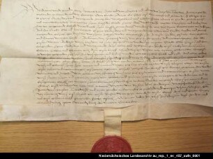 Herzog Carl von Geldern belehnt den Junker Balthasar von Esens mit der Herrlichkeit Esens Anhängendes Siegel erhalten; Unterschrift