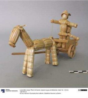 Pferd mit Karren, darauf Junge und Mädchen