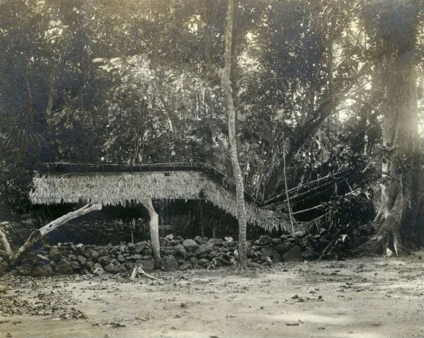 "Sacred enclosure with half collapsed house, Lamasong"