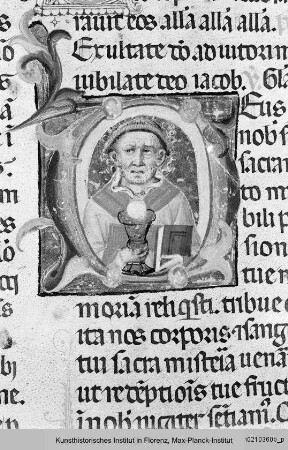 Missale Romanum : Textseite mit historisierter Initiale D: Heiliger Diakon mit Buch und Kelch