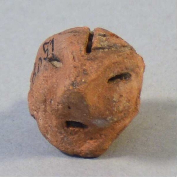 Clay head (fragment of a burial urn)