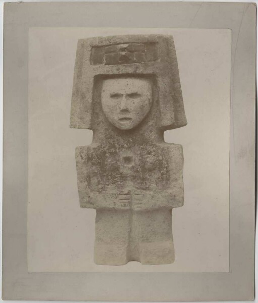 Human stone figure, standing.