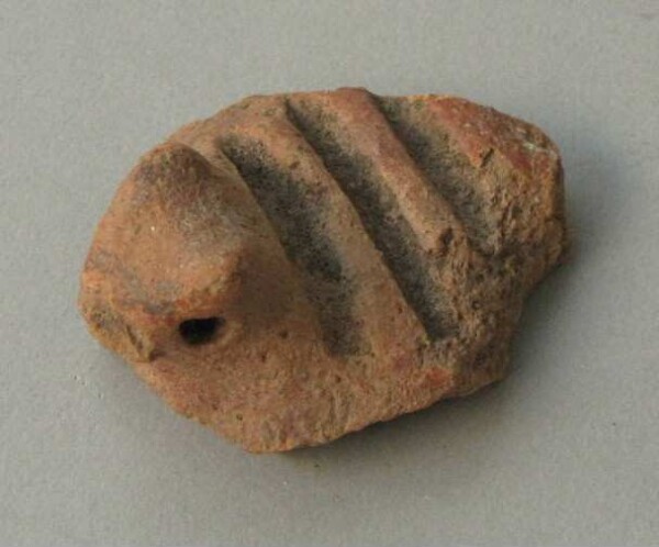 Fragment of a clay vessel decoration