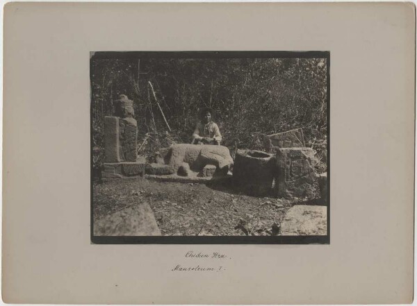 "Various sculptures from the 'Mausoleum I' (the Chac-Mool tomb of Auguste Le Plongeon). (With member of the expedition)."