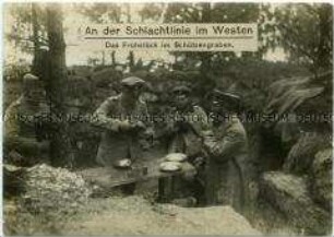 Deutsche Soldaten an der Westfront beim Frühstück im Schützengraben