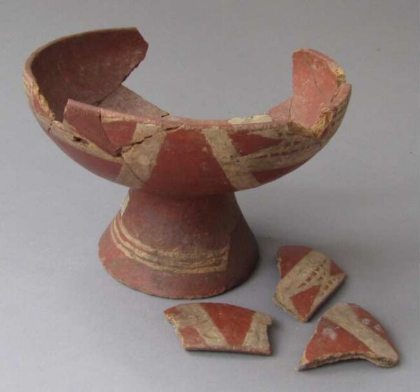 Fragments of a clay bowl with stand