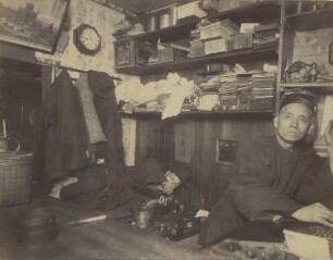 San Francisco: Chinatown - opium den underground : smoker caught lighting his pipe