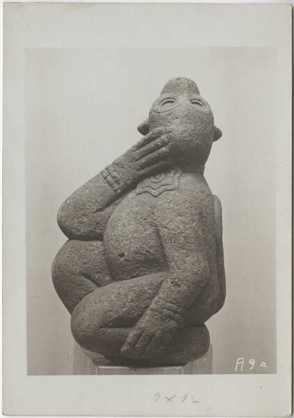 "Stone figure of a dancing monkey with arm rings and snail chest jewellery of Macuilxochitl (?)"