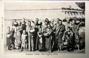 Buddhist Priests with begging bowls.