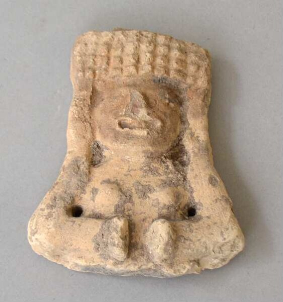 Upper body with head of a clay figure