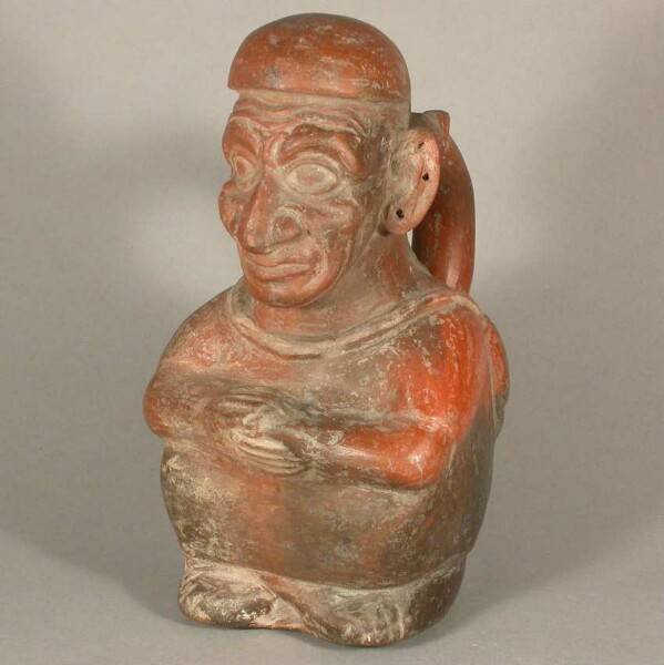 Seated anthropomorphic figure