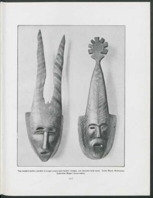 [Photograph of] Two wooden masks, painted in bright colors with feather designs, not intented to be worn. : Santa María, Michoacan. Collection Miguel Covarrubias.