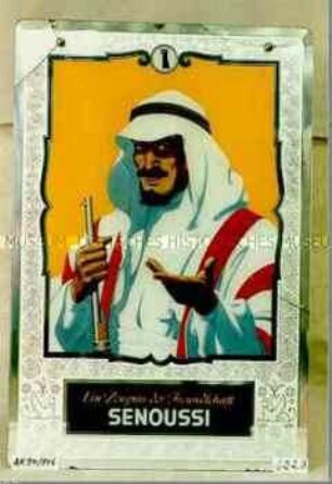 Werbeschild mit Aufdruck "Ein Zeugnis für Freundschaft SENOUSSI" (Abbildung eines Arabers mit Gewehr)