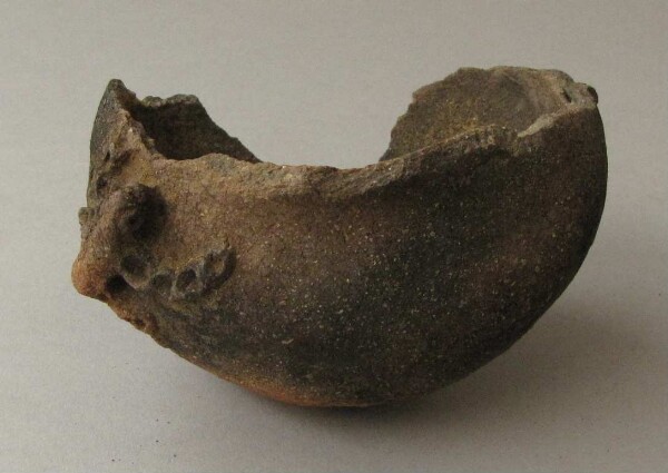 Fragment of a clay vessel