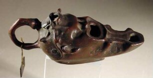 Lampe in Form eines bekränzten Schauspielerkopfes