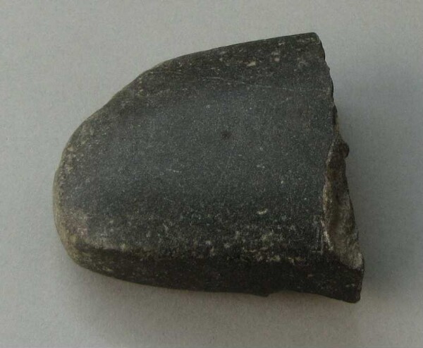 Stone axe blade (fragment) (?)