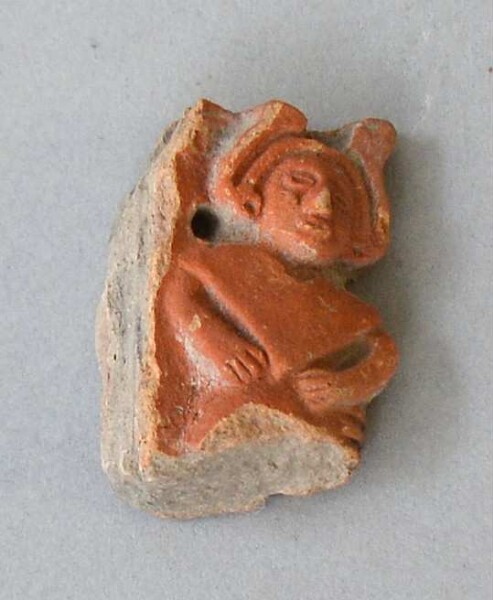 Figurine en argile (fragment de récipient)