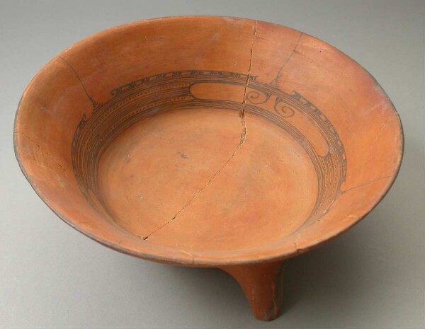 Three-footed clay bowl