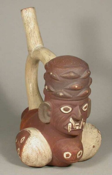 Anthropo-zoomorphic figure with feline teeth