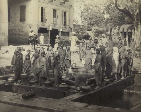 Water carriers at the well in Bombay