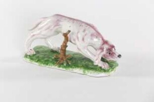 Hund mit geneigtem Kopf in manganvioletter Bemalung aus einem Desserttafelaufsatz
