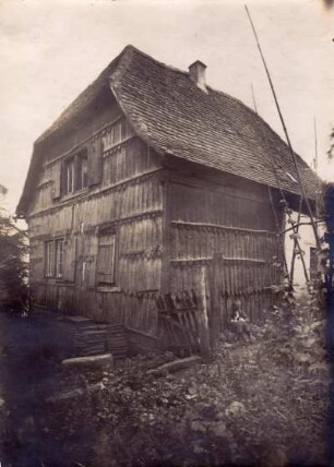 Münchweiler an der Alsenz. Haus mit Schindelbekleidung
