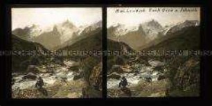 Mann am Fluss, Dorf und Gebirge, Meije, im Hintergrund