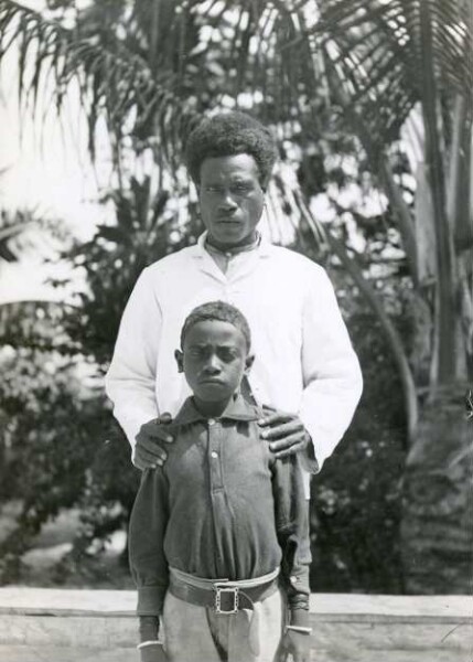 "Missionary and his son. Bugotu."