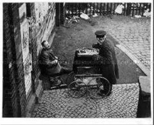 Bettler streiten um den besten Platz